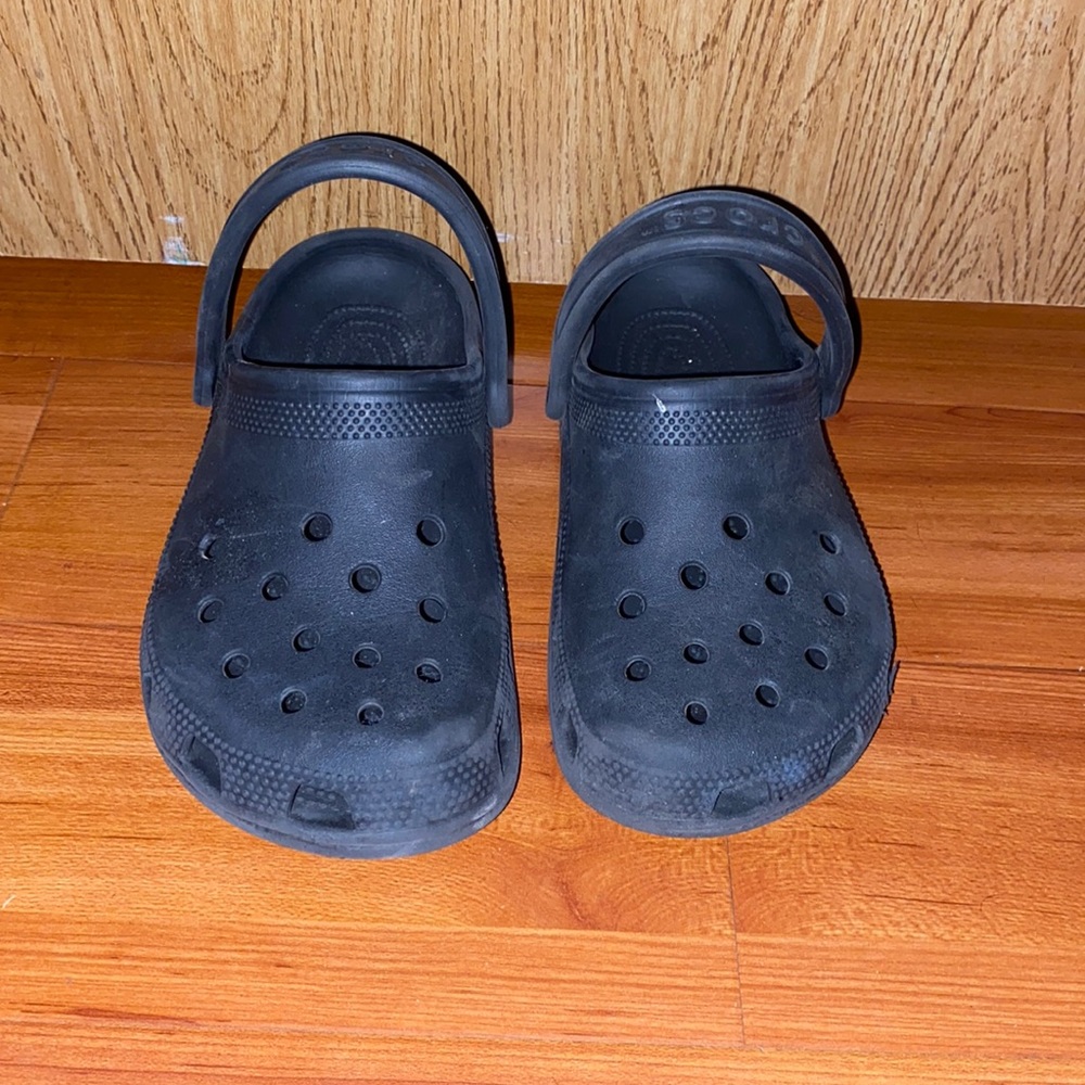 Worn black crocs